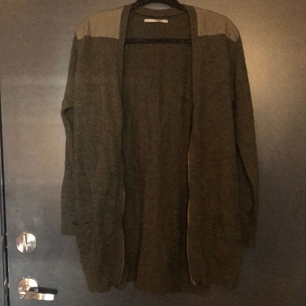 Green zip up cardigan.